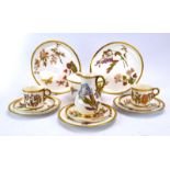 A Royal Worcester part coffee service gilt decorated with butterflies and flowering shrubs on a