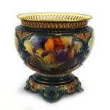 A Royal Worcester bowl, the pierced border above four panels,
