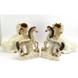 A pair of Staffordshire flatback figures modelled as zebra, h. 29.