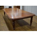 A late 19th century mahogany extending dining table, with three fitted leaves,
