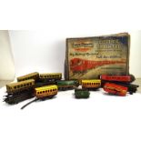 A part Ever Ready electric train set, boxed, together with a 'Hurricane' clockwork train, coaches,