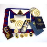 A group of Masonic regalia including aprons, gilt metal jewels, books etc.