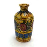 A 19th century Middle Eastern stoneware bottle vase decorated with stylised flowers on a sand