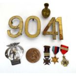 A group of collectables including metal number signs, a bronze Metier d'art medallian, medals,