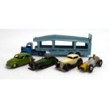 A group of playworn diecast including pre-war and later Dinky saloon cars, racing cars,