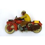 A Mettoy tinplate clockwork motorcycle and rider, registration no.