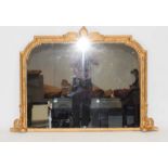 A 19th century giltwood overmantle mirror surmounted by a foliate pediment, w.