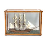 A model of the sailing ship 'Arklow Rock' within a beech and five-glass case, h.