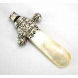 An Edwardian silver and mother of pearl child's rattle with whistle and teething section, maker H&T,