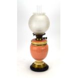 A Hinks & Son pink ceramic oil lamp with an etched glass shade, h.