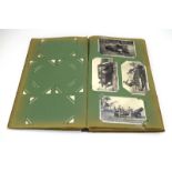 An album containing one hundred and forty postcards including First World War silks,