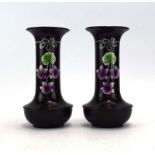 A pair of early 20th century Shelley bottle vases decorated in the 'Violette' pattern on a black