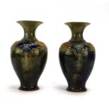 A pair of Royal Doulton vases of slender baluster form,