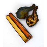 A cased amber cheroot holder with a 9ct gold mount,
