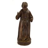 A carved wooden figure modelled as a saint, h.