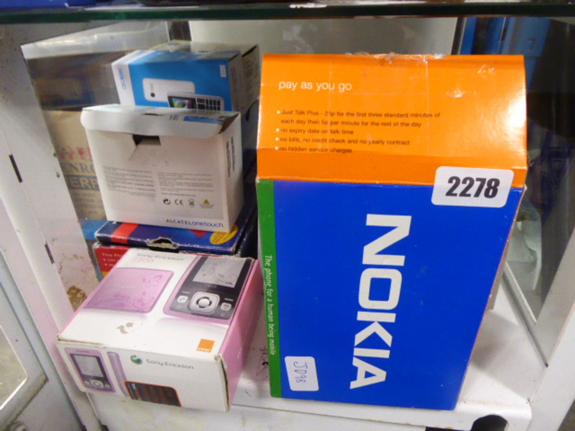 Various boxed mobile phones to include a Nokia 5210E