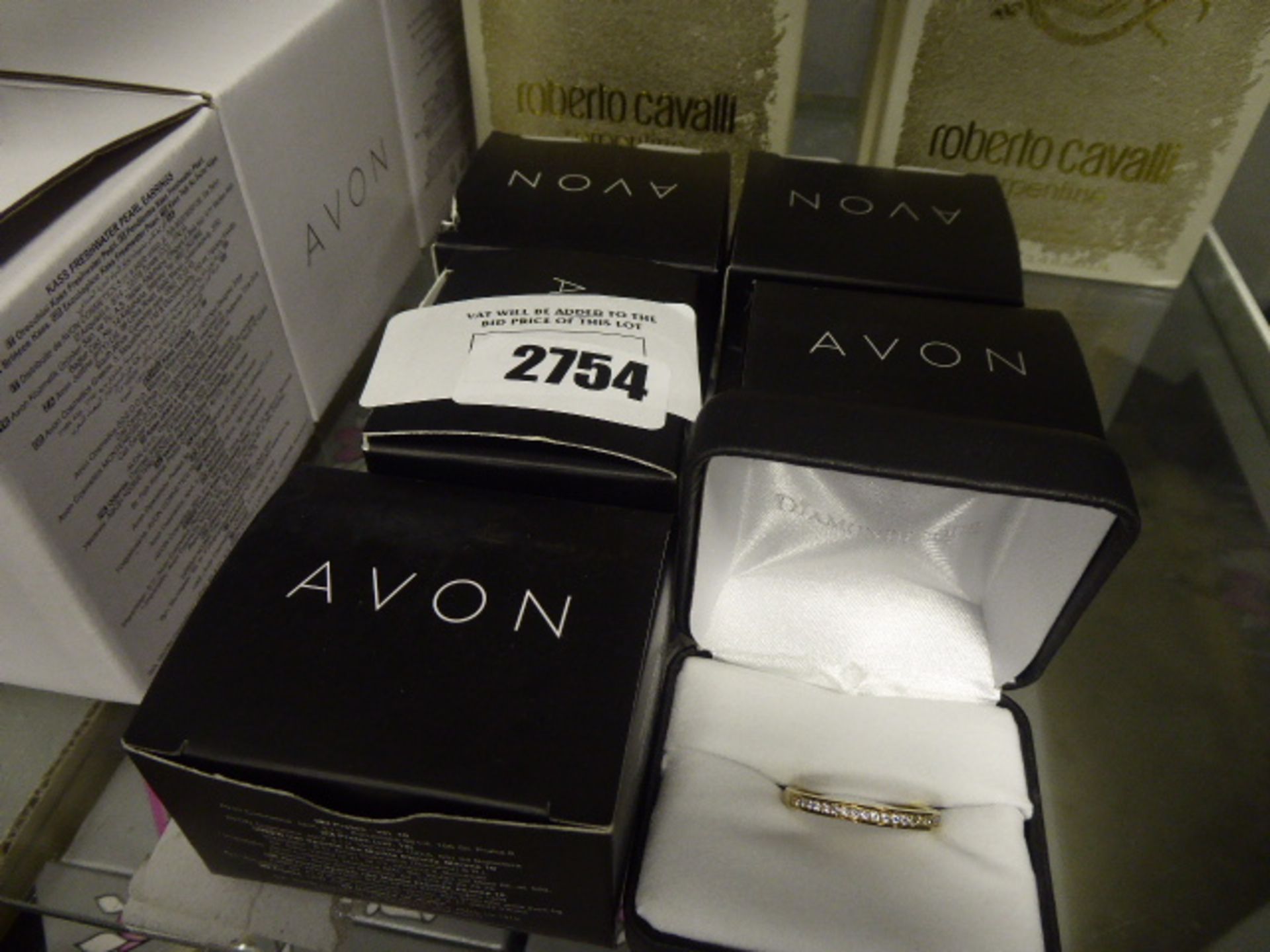 6 boxed Avon gold plated rings with cases