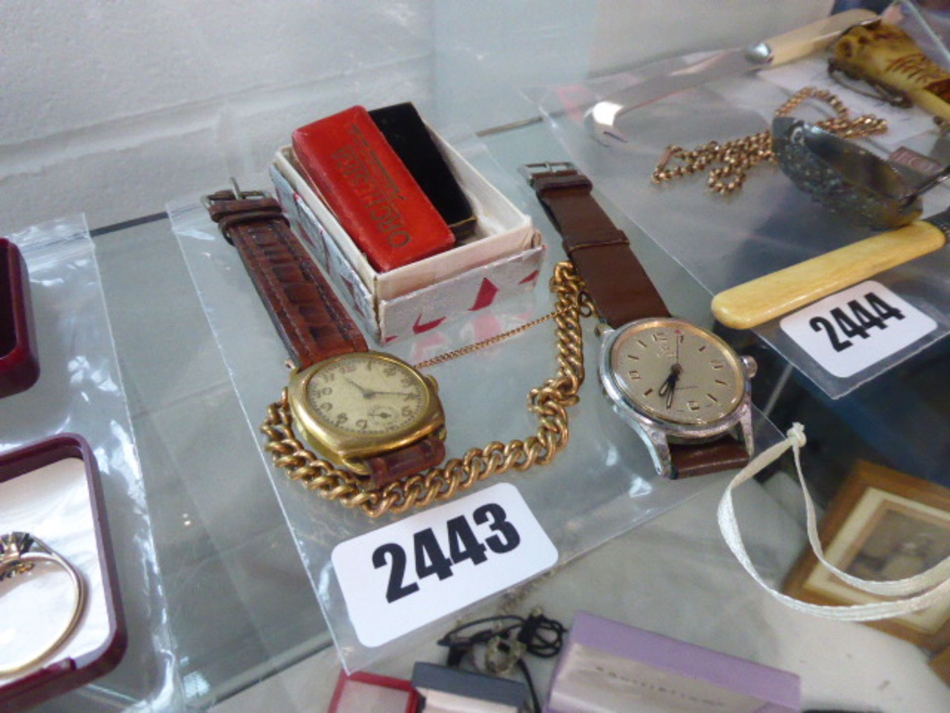 Two vintage gents watches together with a chain and other items
