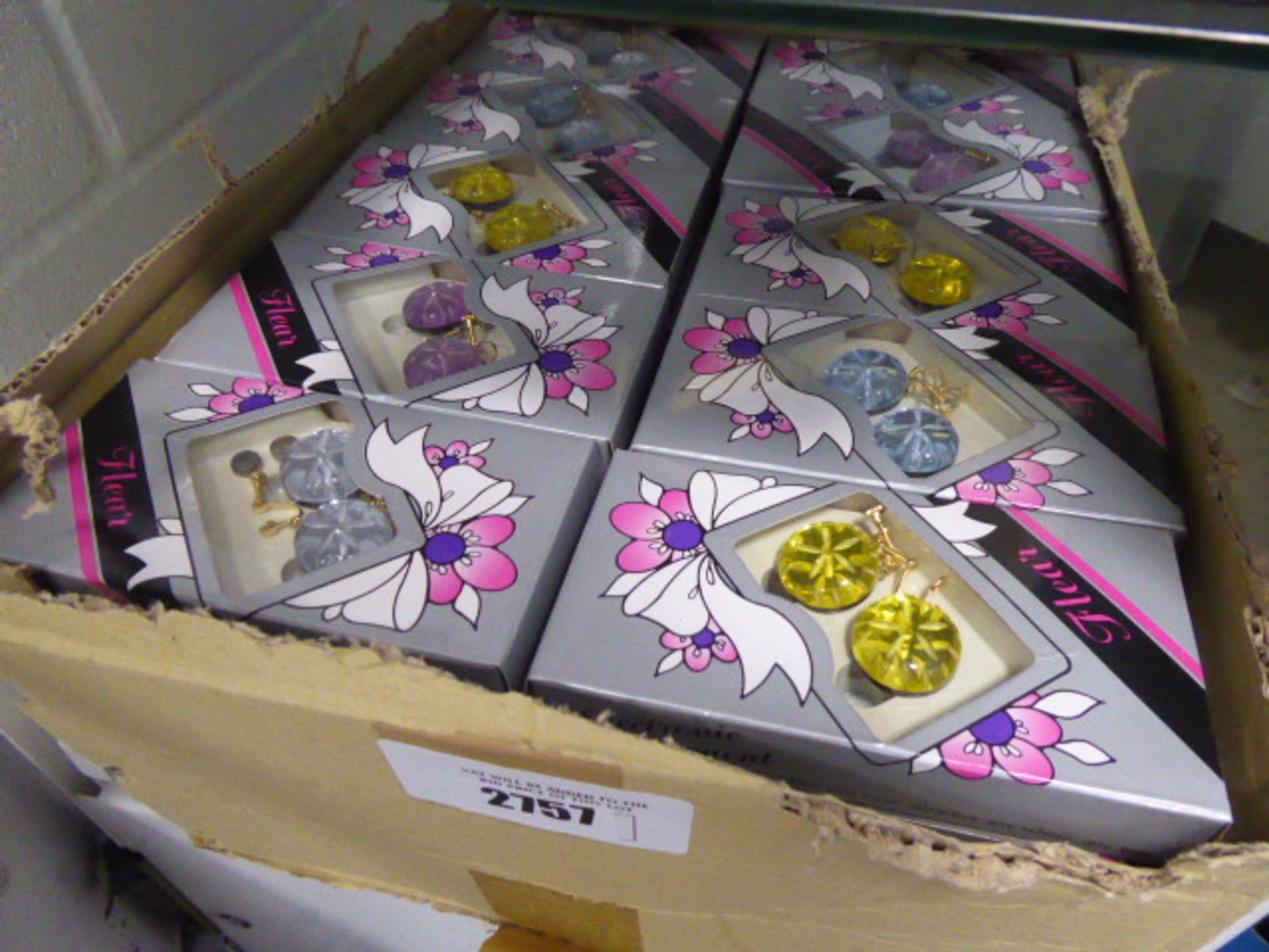 Box containing a large quantity of illuminated earrings