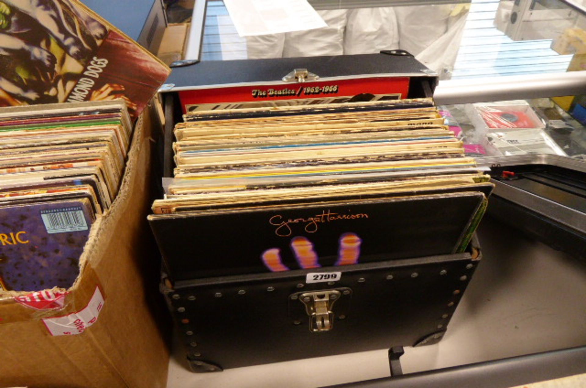 Box containing vinyl record LP's inc. George Harrison, Beatles, Fleetwood Mac, Bob Dylan, Alice
