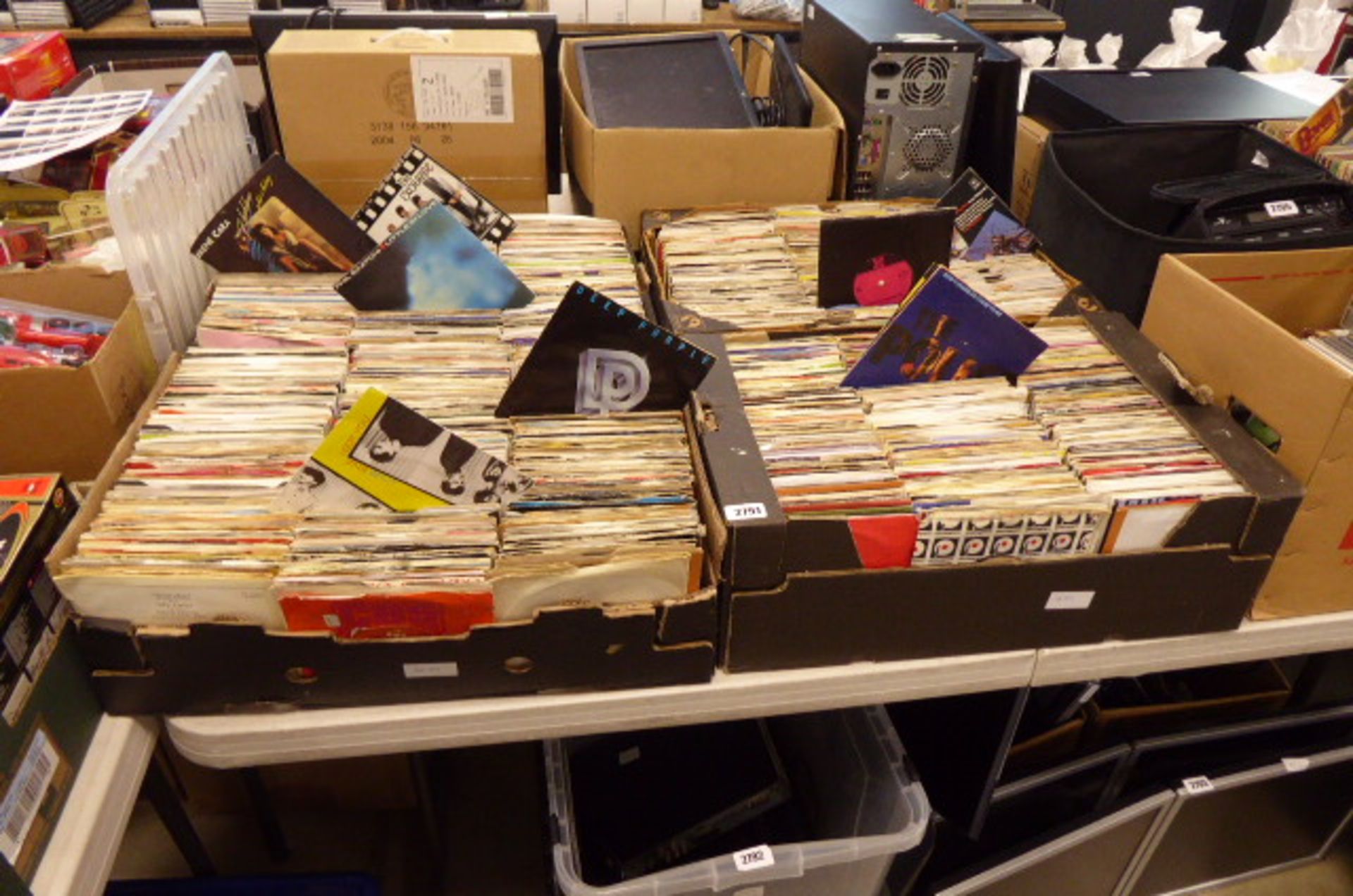 4 trays of large quantity of vinyl record singles inc. Police, Adam Ant, The Exchange, Deep Purple