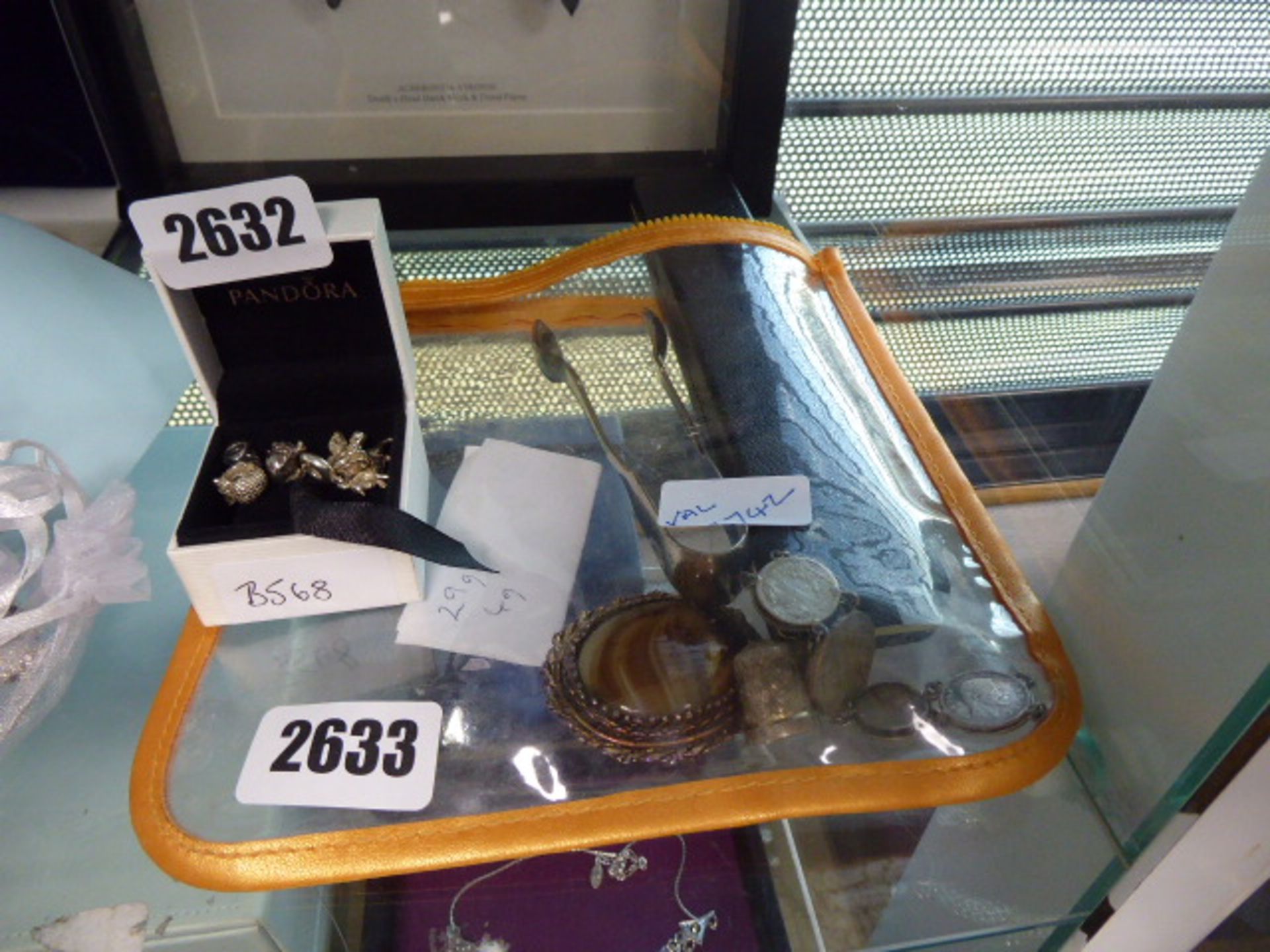 Selection of items inc. brooch, tongs, silver thimble, coinage as a bracelet