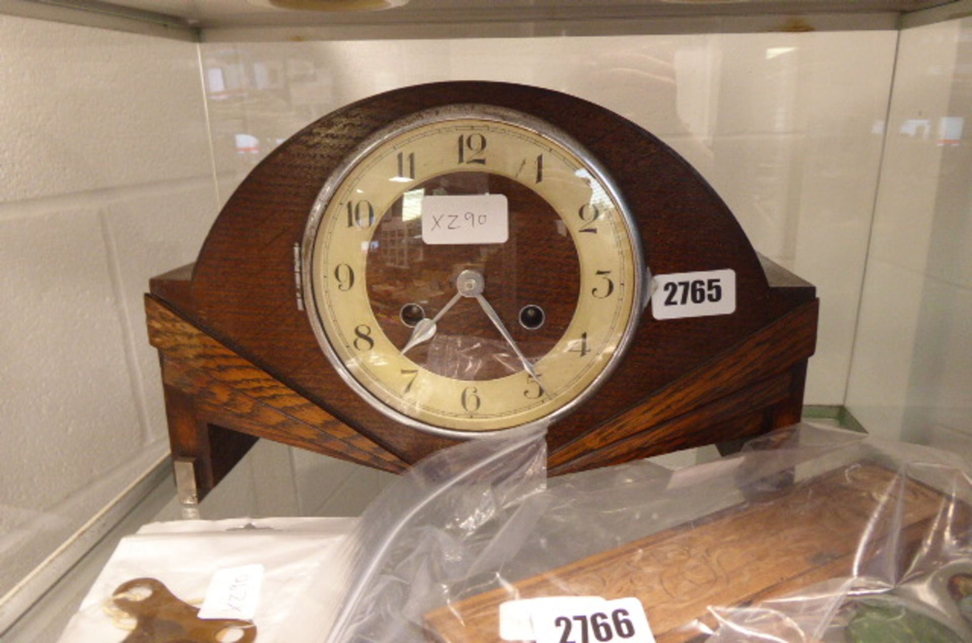 Wooden cased Art Deco style mantle clock with key and pendulum