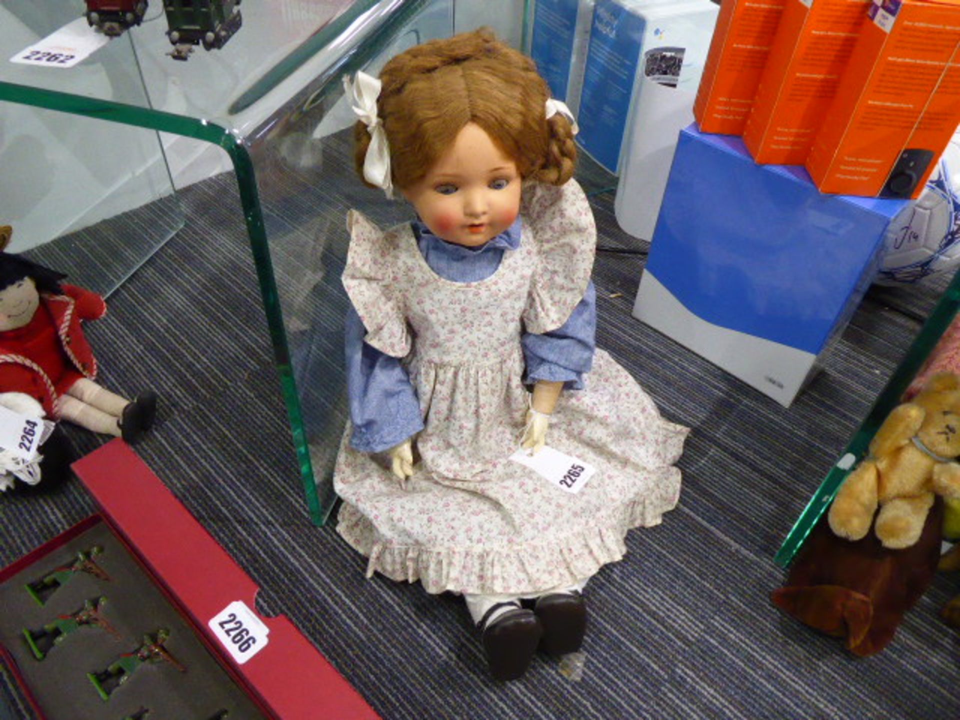 518rr A composition headed doll with sleeping blue glass eyes and open mouth showing two upper