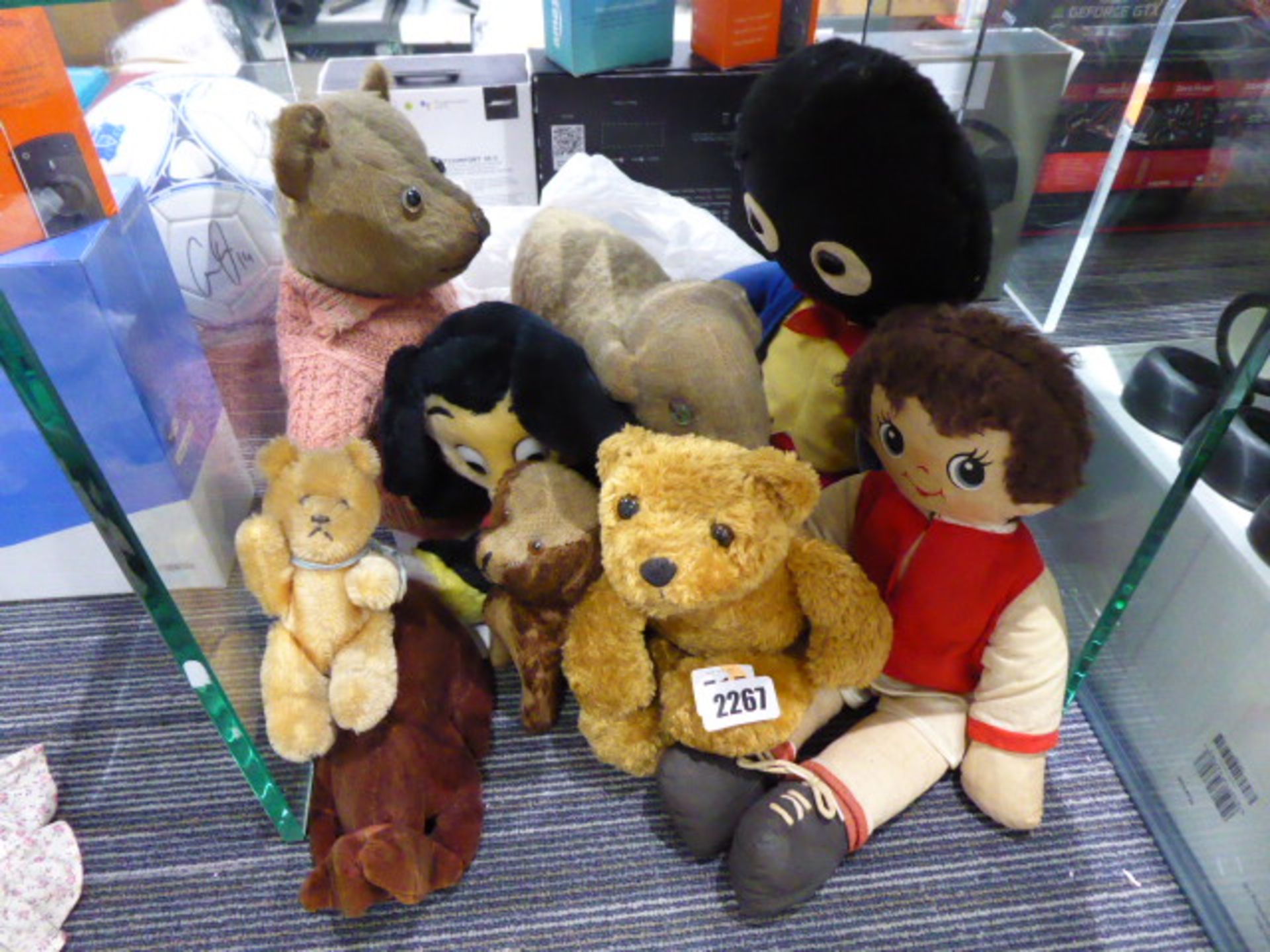 515rr A group of soft toys including an English fully jointed bear, a lamb, a golly, rabbit,