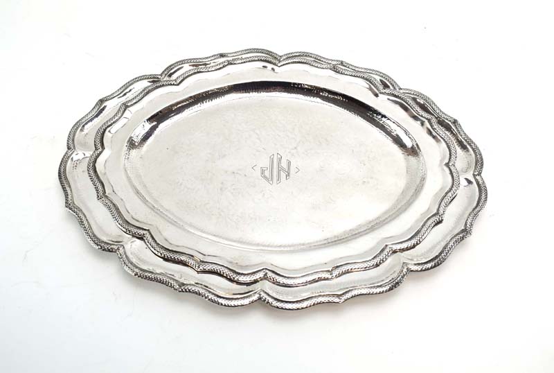 A graduated pair of (?)South American silver serving dishes of oval flowerhead form, - Image 2 of 4