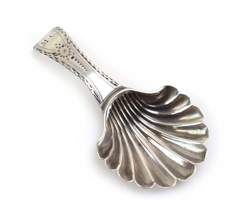 A George III silver caddy spoon with wrigglework handle, Peter and Anne Bateman, London 1793, l. 7.