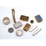 A mixed parcel of silver comprising a napkin ring, two mother of pearl fruit knives, a watch fob,