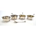 A set of four Victorian silver salts of flowerhead form, each on three bun feet, Hayes Brothers,