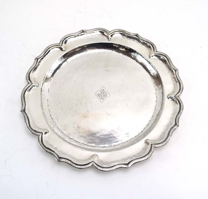 A (?)South American silver salver of circular flowerhead form, base stamped 'La Perla .900', d.