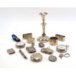A mixed parcel of silver comprising a dwarf candlestick, four napkin rings, three pocket watches,
