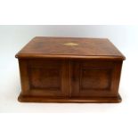 A late 19th/early 20th century burr walnut and brass mounted canteen of three drawers enclosed by a