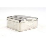 A mid-20th century silver engine turned cigarette box of square form, Adie Brothers,