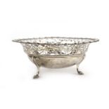 A pierced silver bon bon dish of circular form on three scrolled feet, James Dixon & Sons,