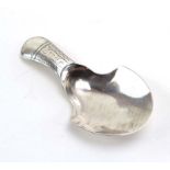 A George III silver caddy spoon with wrigglework handle, maker IT, Birmingham 1810, l.