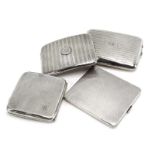 Four early-mid 20th century silver gilt cigarette cases, various dates and makers,
