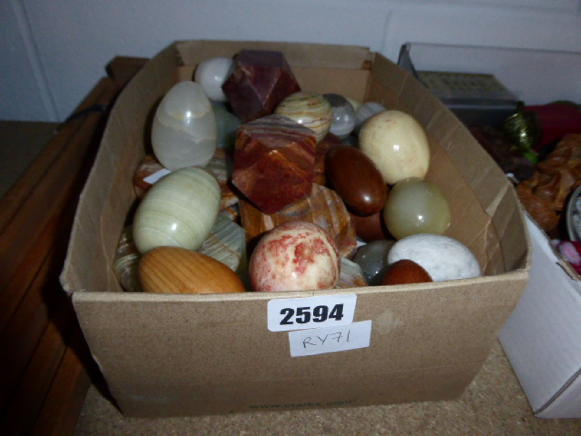 Selection of hard stone eggs with stands