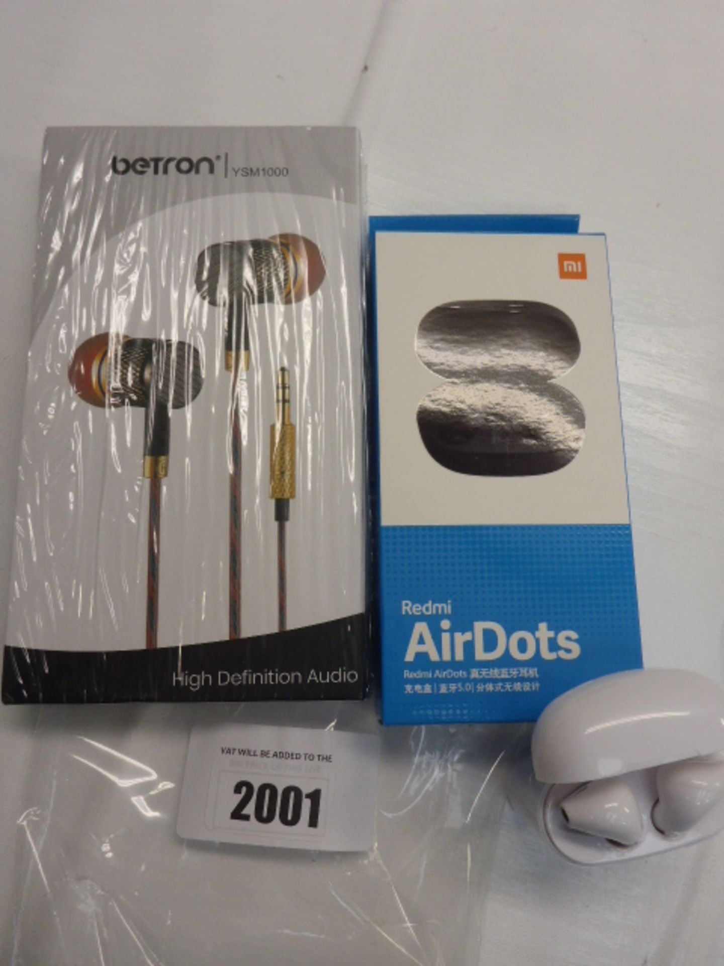 Betron earphones, Redmi AirDots wireless earphones and one other pair of wireless earphones