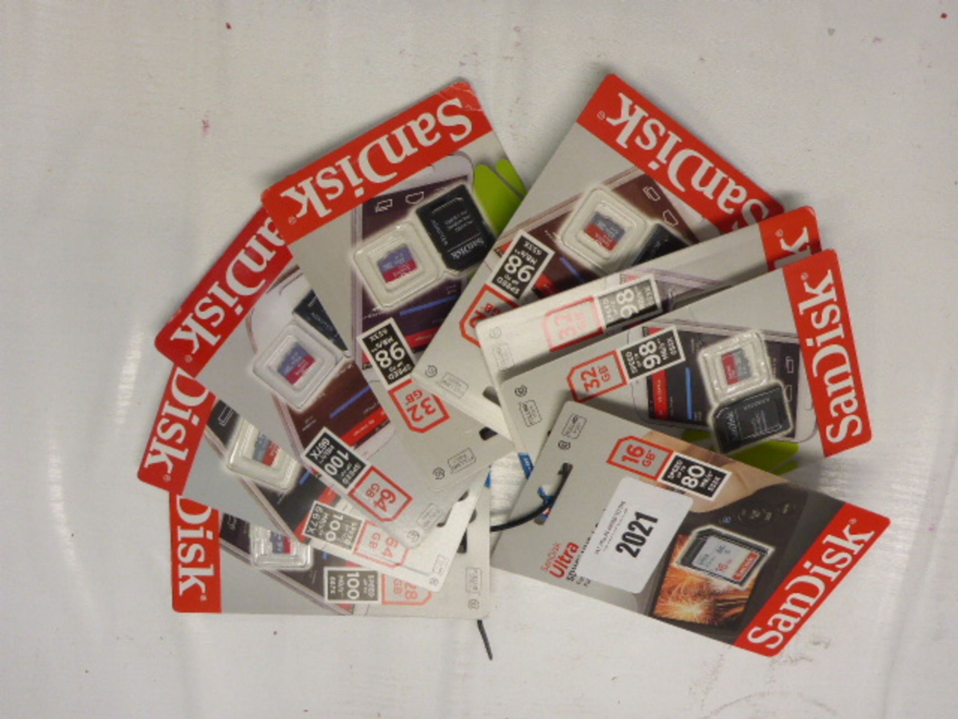 8x SanDisk SD and MicroSD cards in various capacities