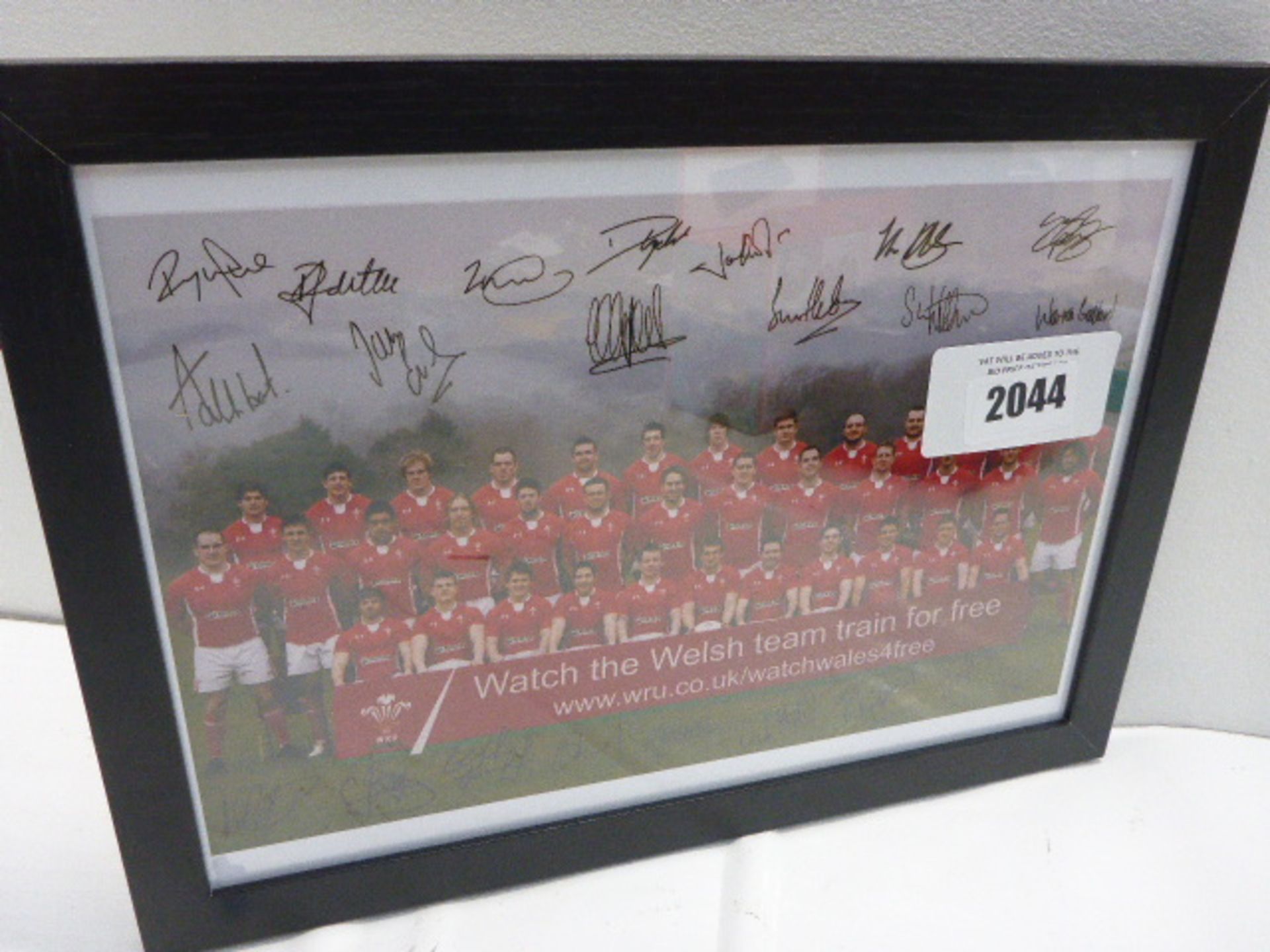 Printed photo and signatures of Welsh rugby tgeam