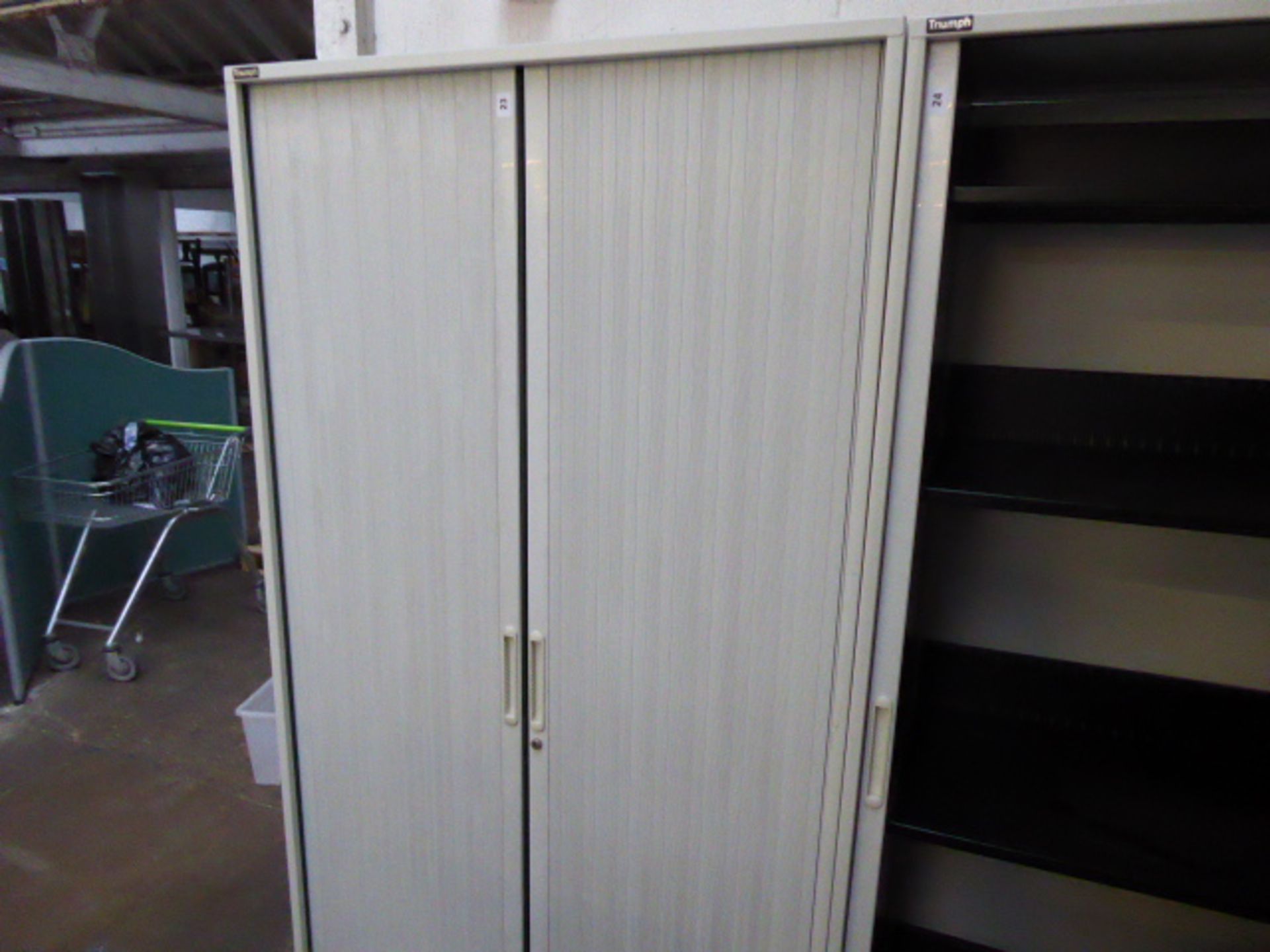 A 100cm wide by 200cm tall Triumph tambour fronted cabinet in grey