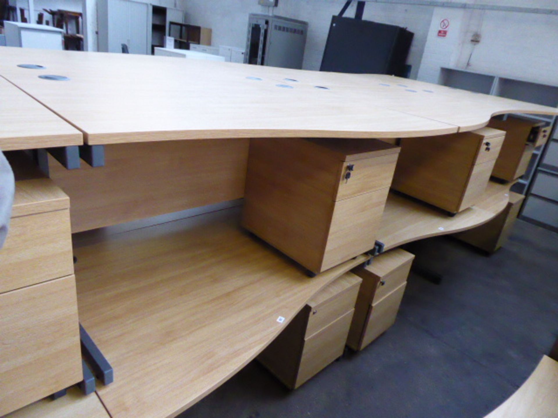 2 140cm light oak effect desks with a wave on cantilever legs and 2 matching pedestals with opposing