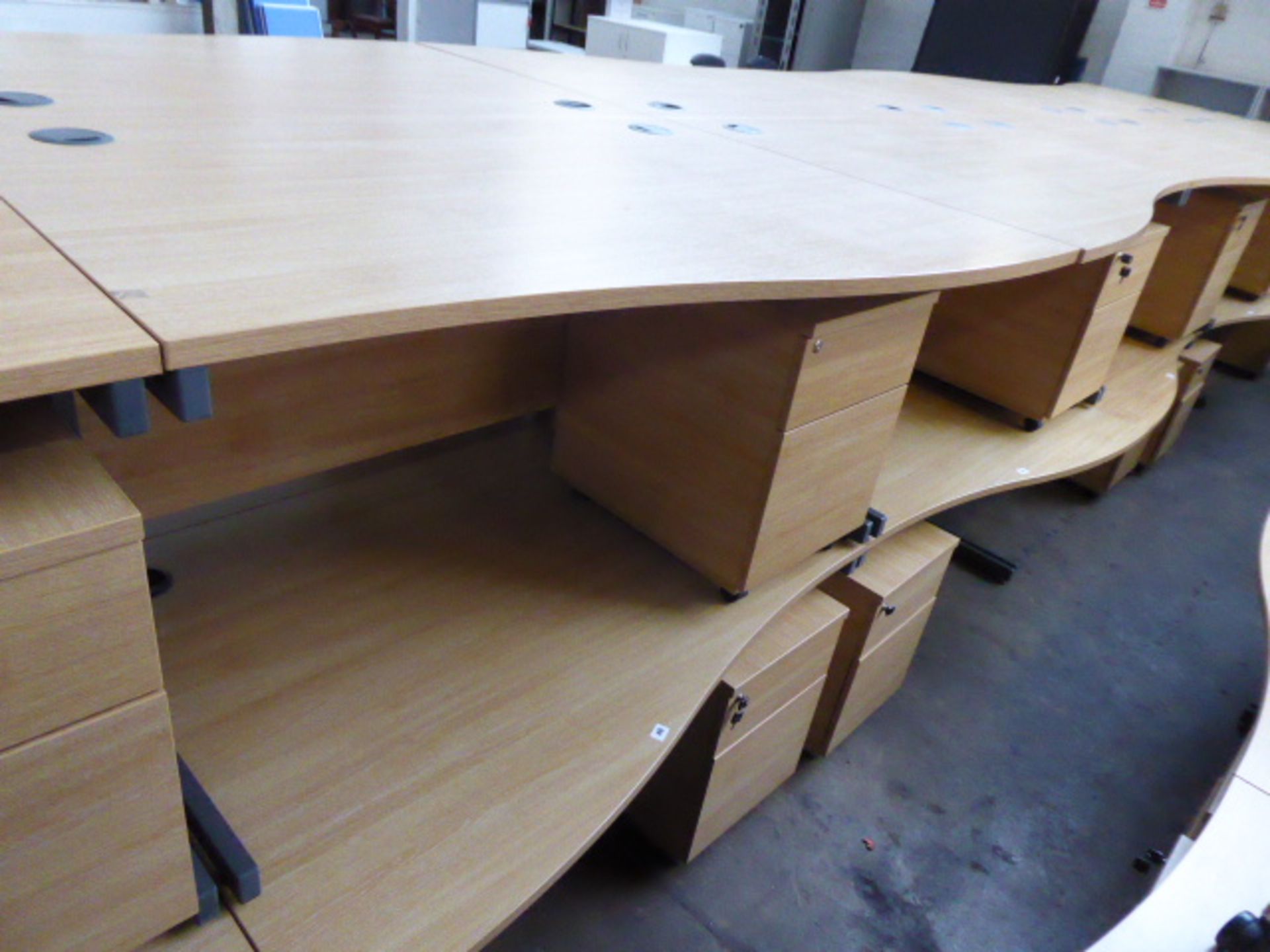 2 140cm light oak effect desks with a wave on cantilever legs and 2 matching pedestals with opposing