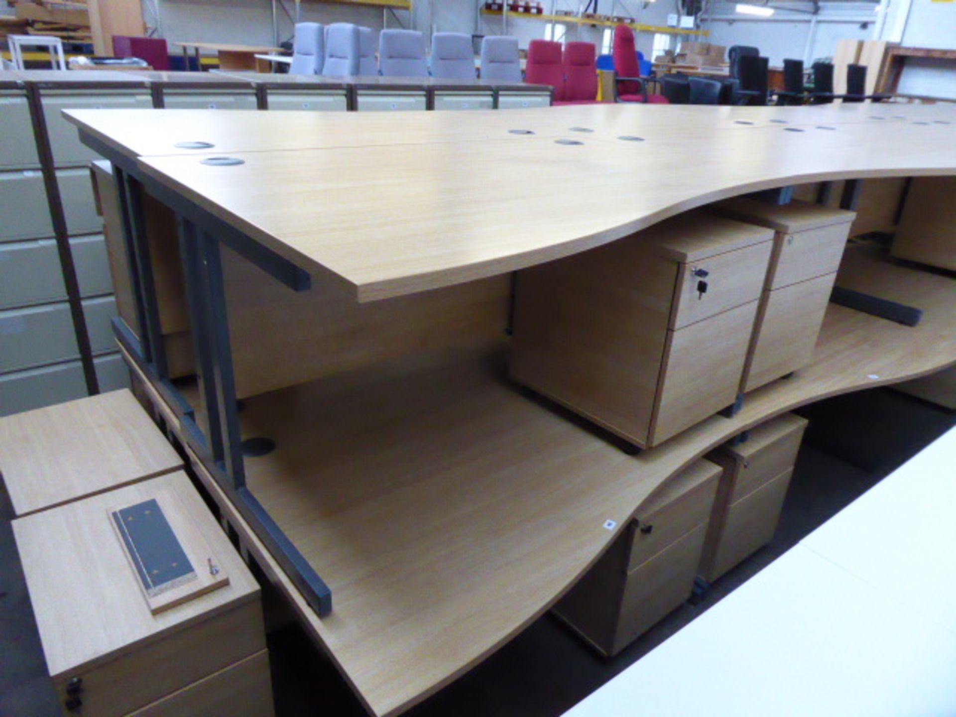 2 140cm light oak effect desks with a wave on cantilever legs and 2 matching pedestals with matching