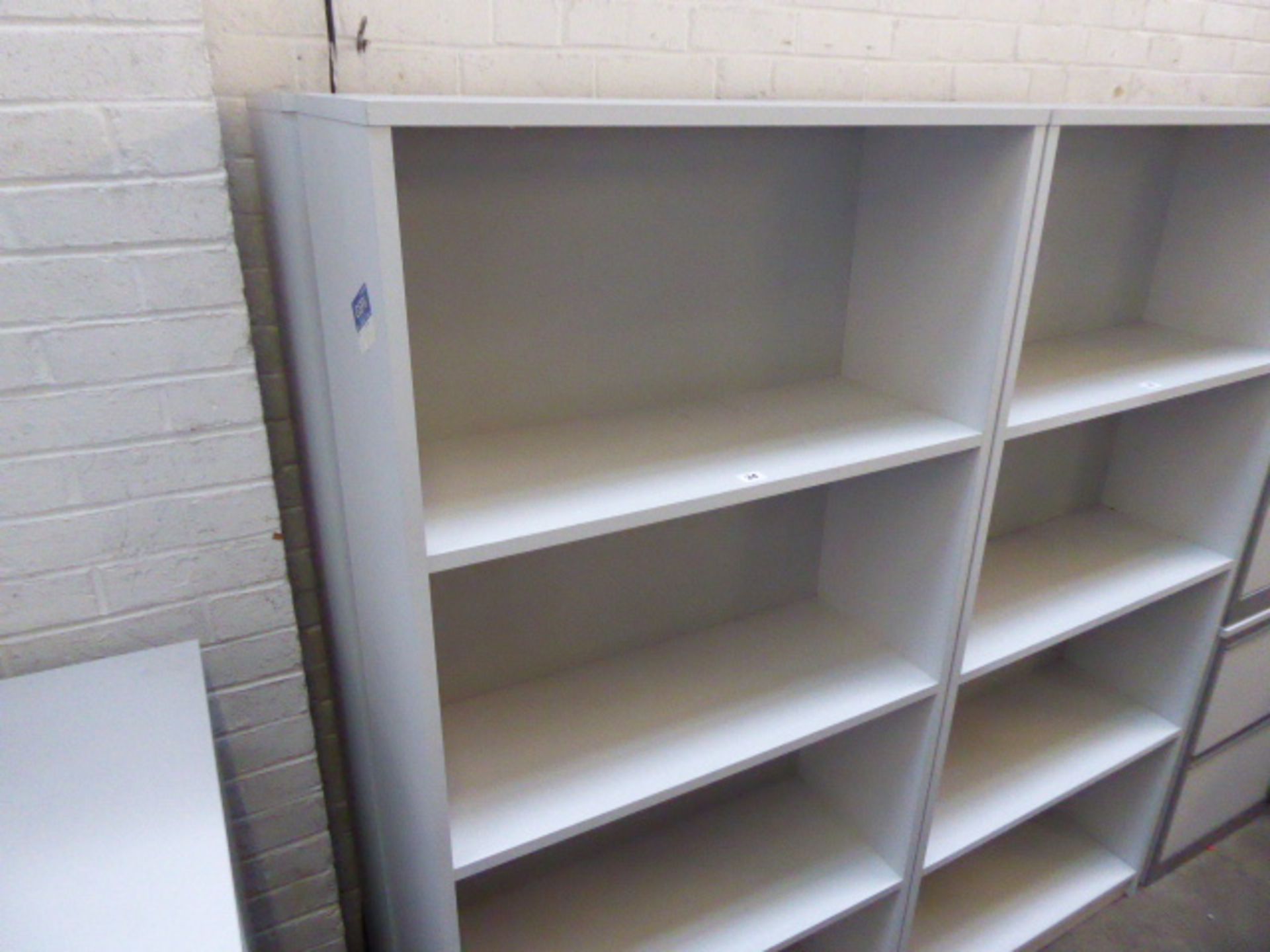 2 75cm wide by 165cm tall open fronted bookshelves