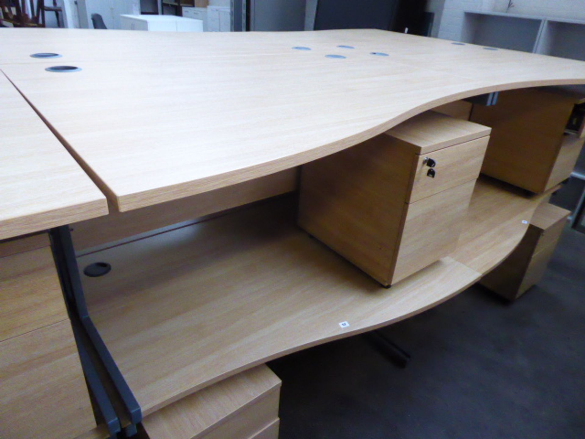 2 140cm light oak effect desks with a wave on cantilever legs and 2 matching pedestals with opposing